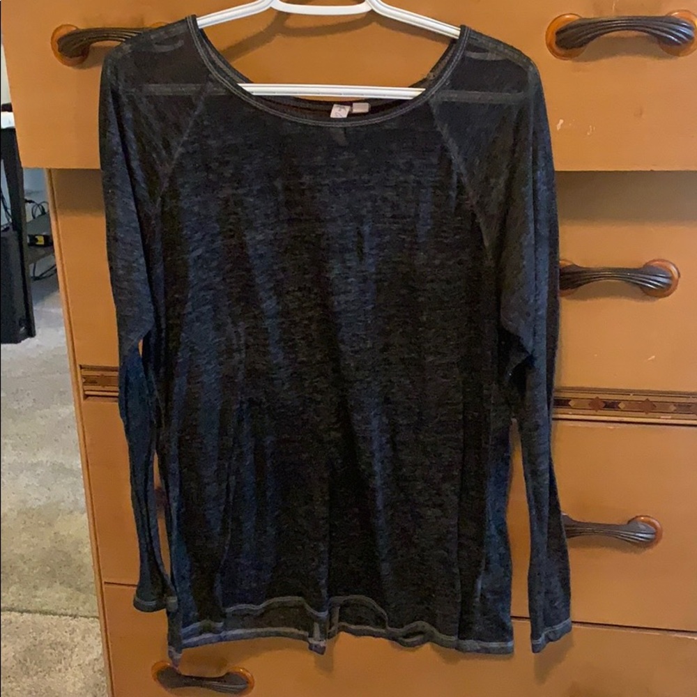 Thin black top with long sleeves and split back.